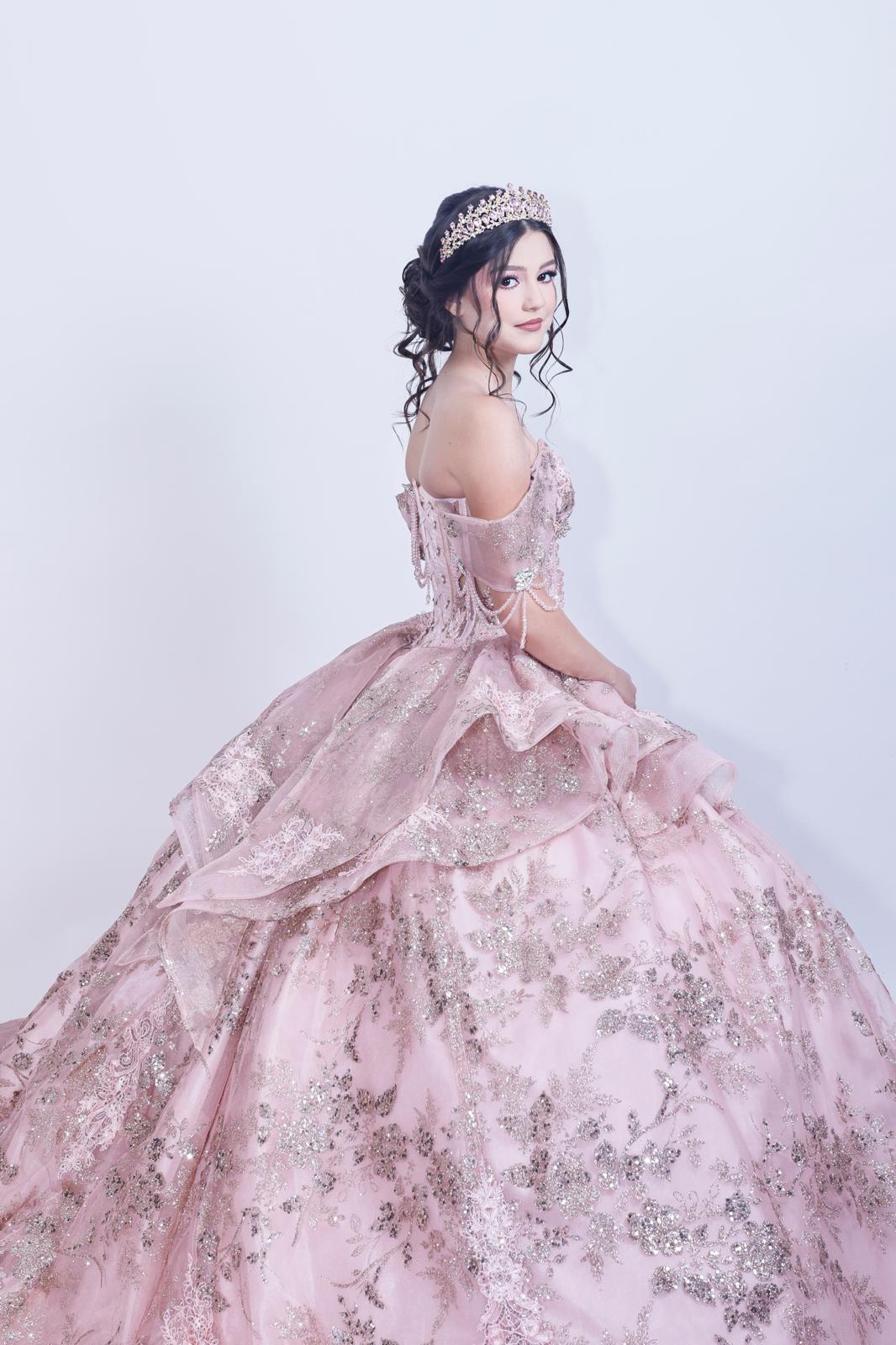 Aneth posing in her sparkling pink ball gown and tiara
